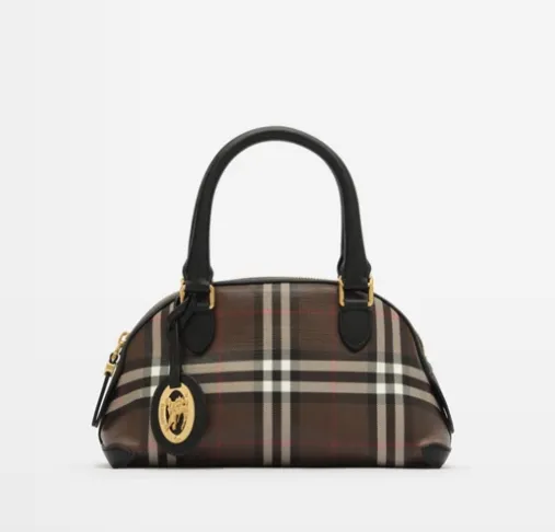 Burberry check dome bag showing hand-painted leather edges and engraved metal charm