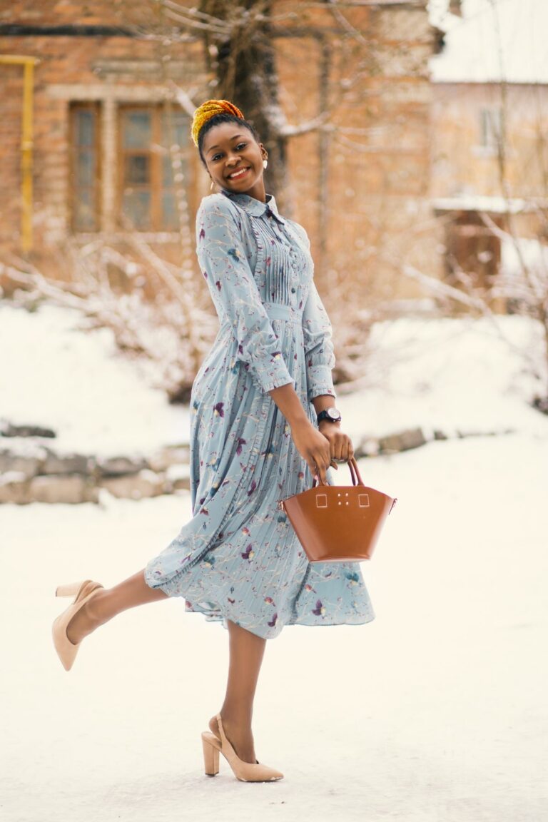 Woman carrying a leather tote bag in the snow in winter