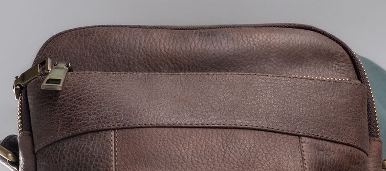 Close-up of grained leather showing the texture that traps dust