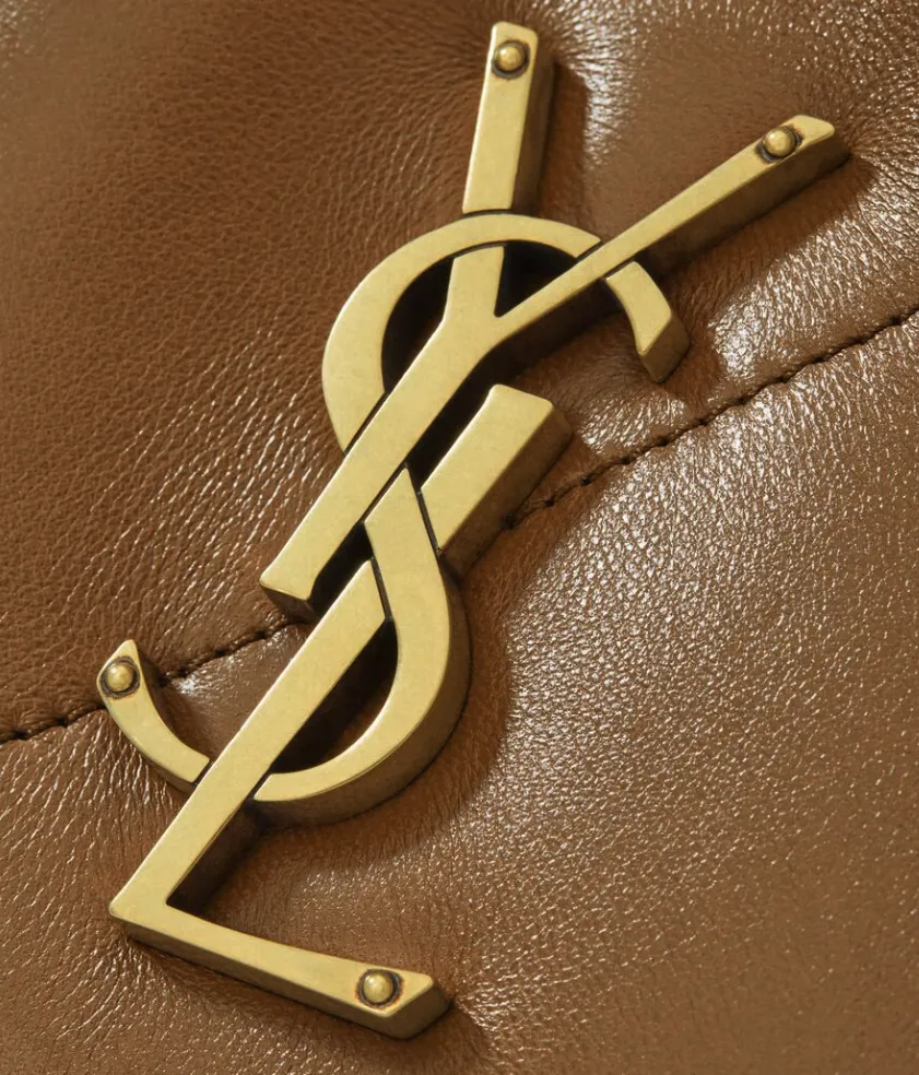 Saint Laurent Cassandre monogram in aged gold on brown quilted leather