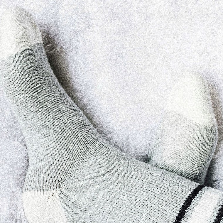 Feet in thick knitted wool socks