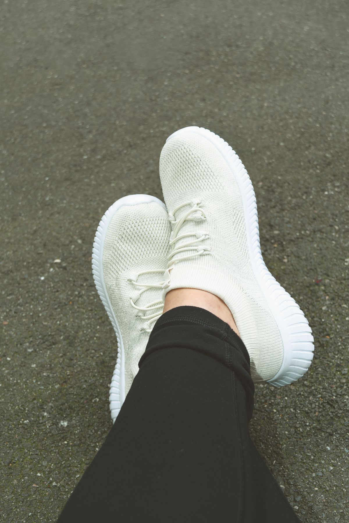 White rubber midsoles on knit sneakers, still an even white with no yellow cast